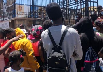 Haitian migrants gather outside a humanitarian project in Ciudad Juárez, MX